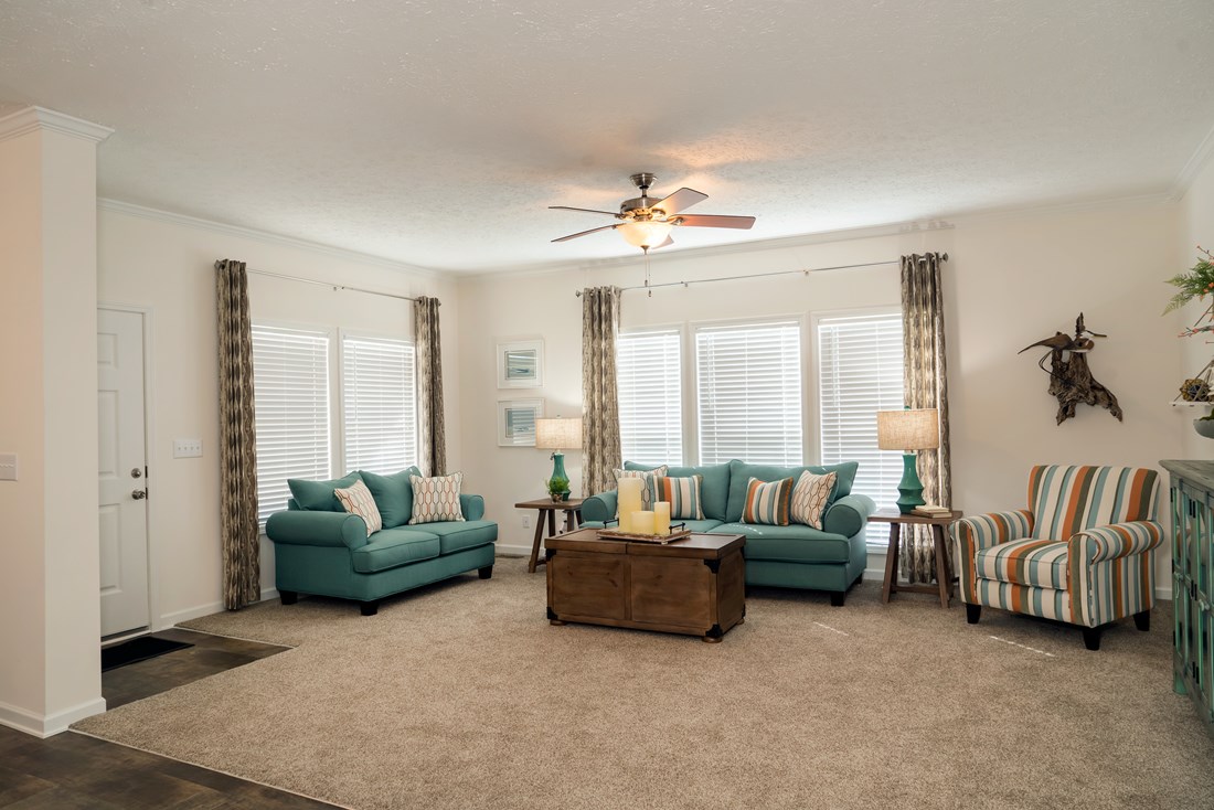The 2466 OAKWOOD MOD Living Room. This Manufactured Mobile Home features 3 bedrooms and 2 baths.