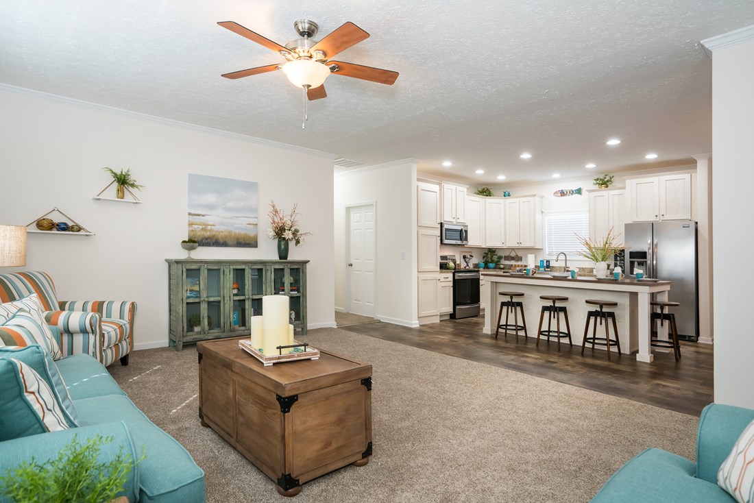 The 2466 OAKWOOD MOD Living Room. This Manufactured Mobile Home features 3 bedrooms and 2 baths.