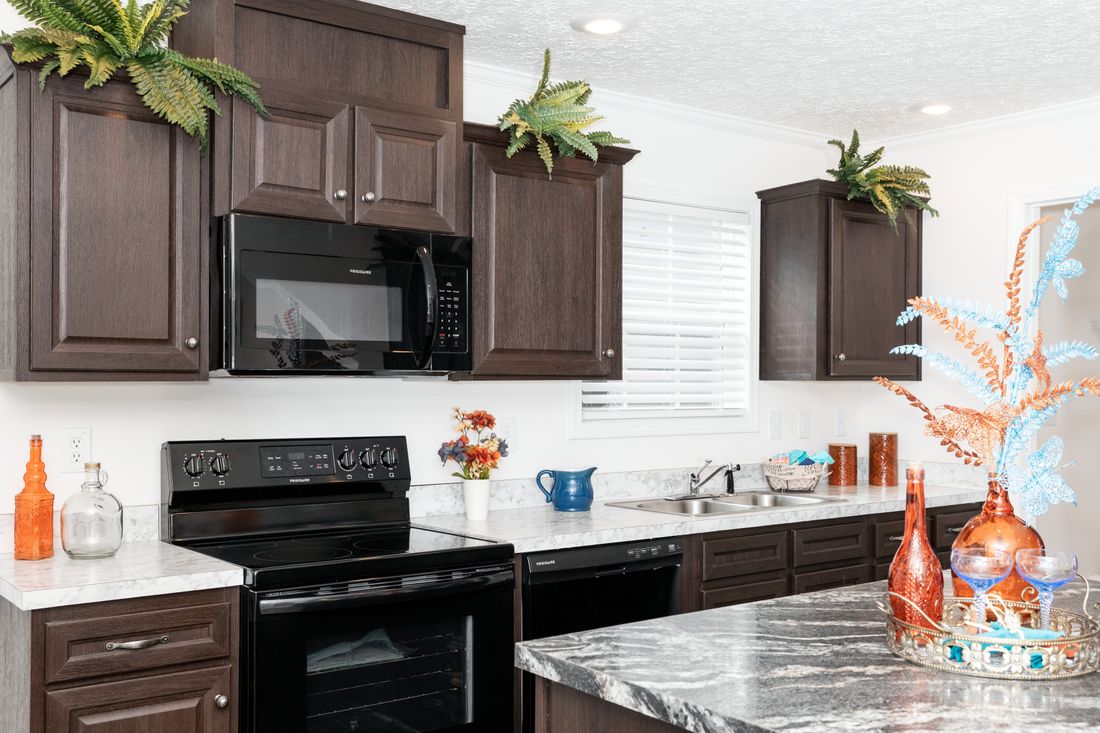 The 1321 CLASSIC Kitchen. This Manufactured Mobile Home features 4 bedrooms and 2 baths.