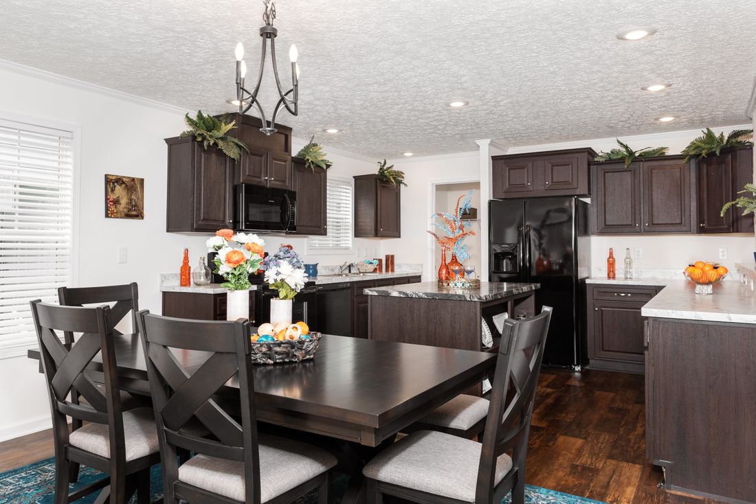 The 1321 CLASSIC Dining Area. This Manufactured Mobile Home features 4 bedrooms and 2 baths.